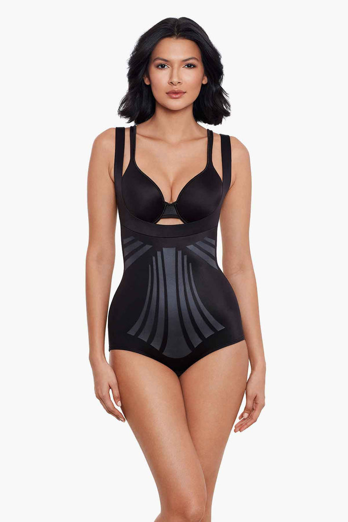 Girl wearing a miracle suit body briefer.