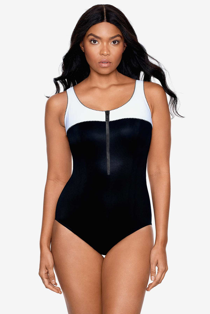Girl wearing one piece miracle swim suit.