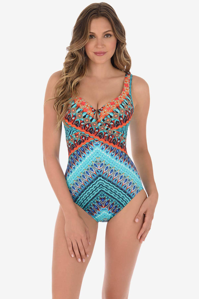 Woman in a miracle suit one piece swim wear.