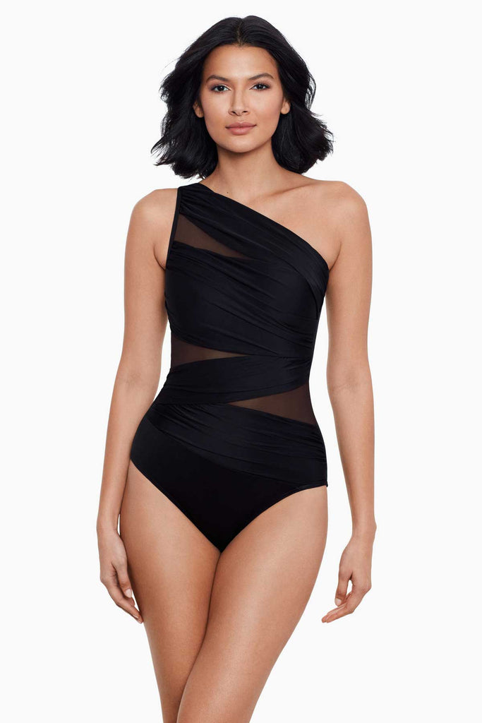 Woman in a slimming one piece swim suit.