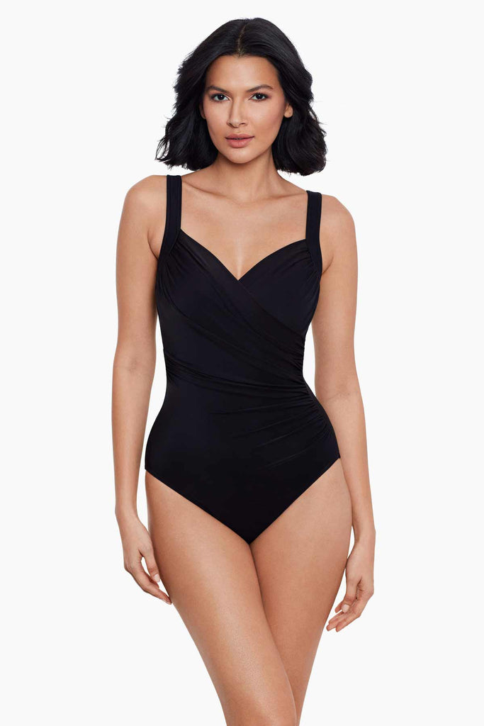 Woman in a miracle suit one piece swim suit.