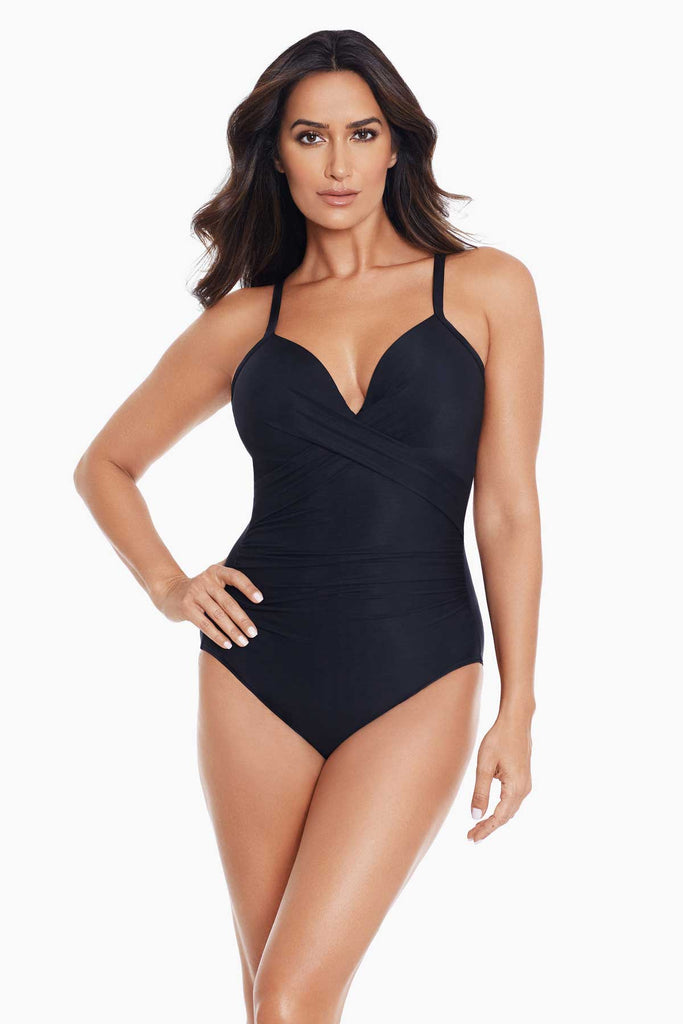 Woman wearing a miracle suit one piece.