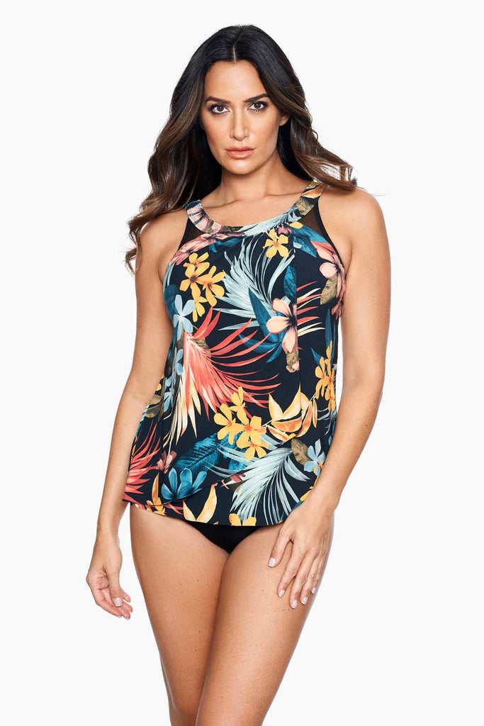 Woman wearing a multi printed tankini swim dress