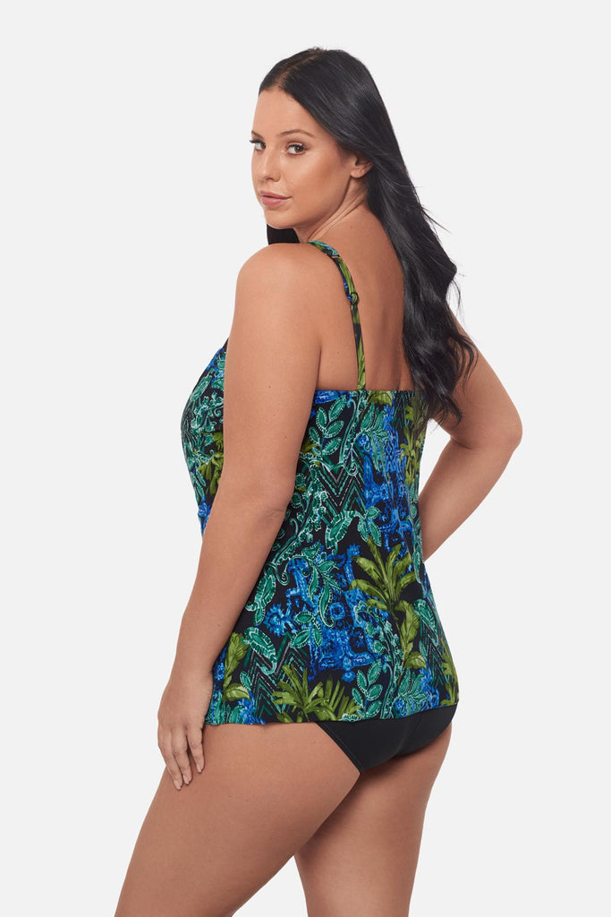 Woman turned left wearing a blue and green abstract print tankini top with mesh details