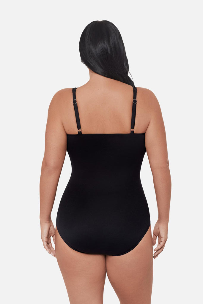 Woman turned away wearing a one-piece swimsuit with adjustable straps