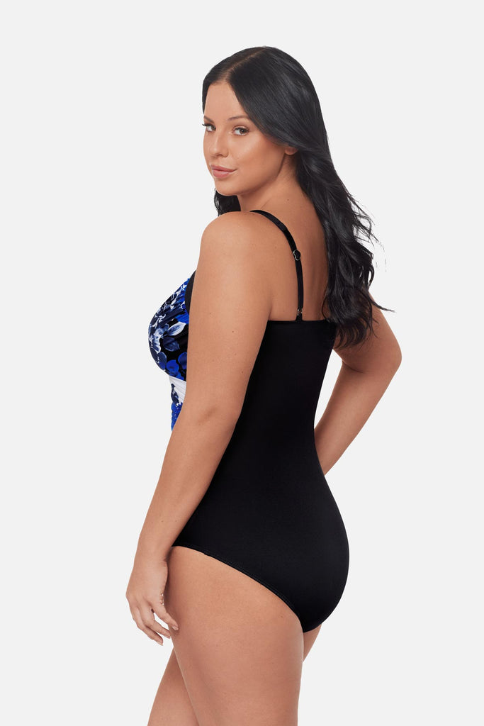 Woman turned left wearing a blue floral pattern one-piece swimsuit