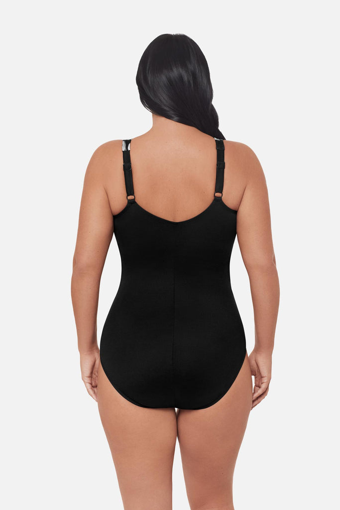 Woman turned away wearing a one-piece swimsuit with adjustable straps