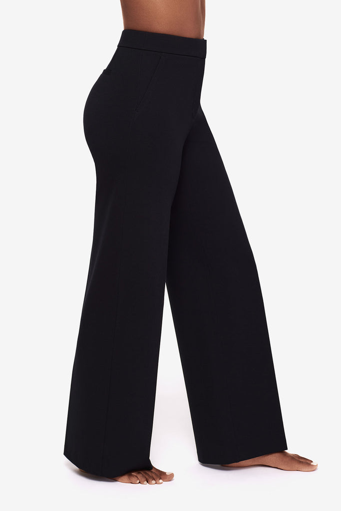 Close up of Woman's legs turned right in black wide legs pants