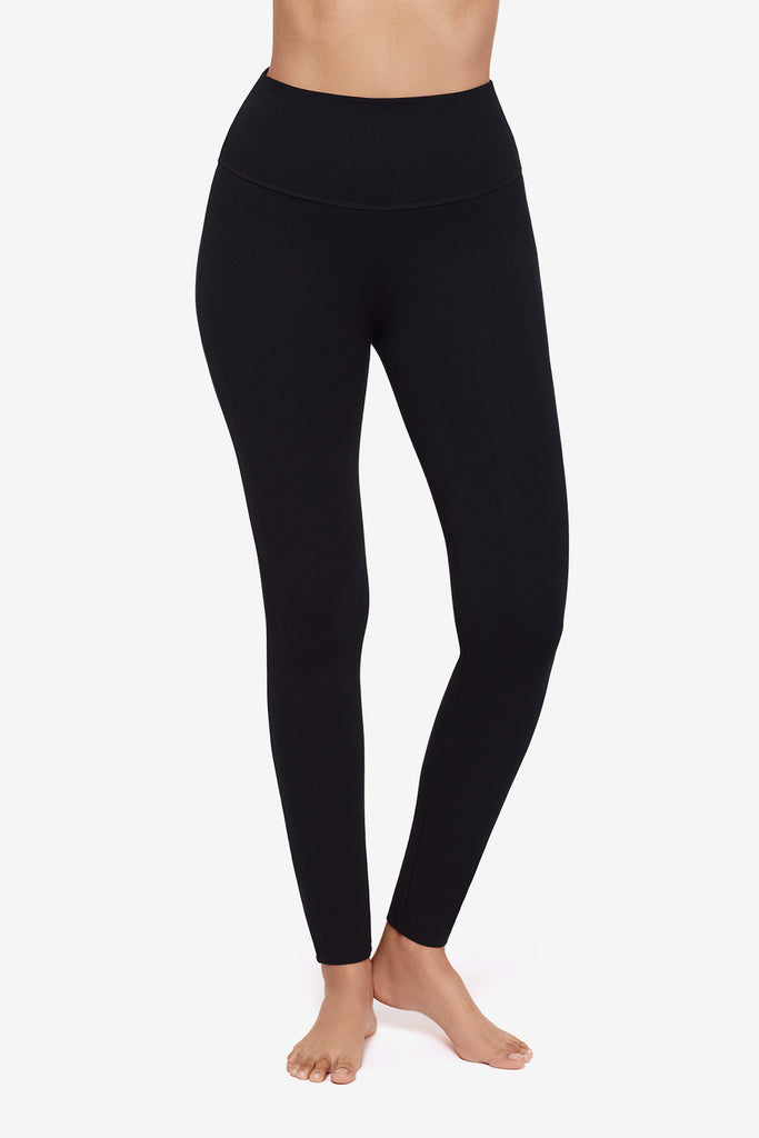 Close up of Woman's legs in black leggings