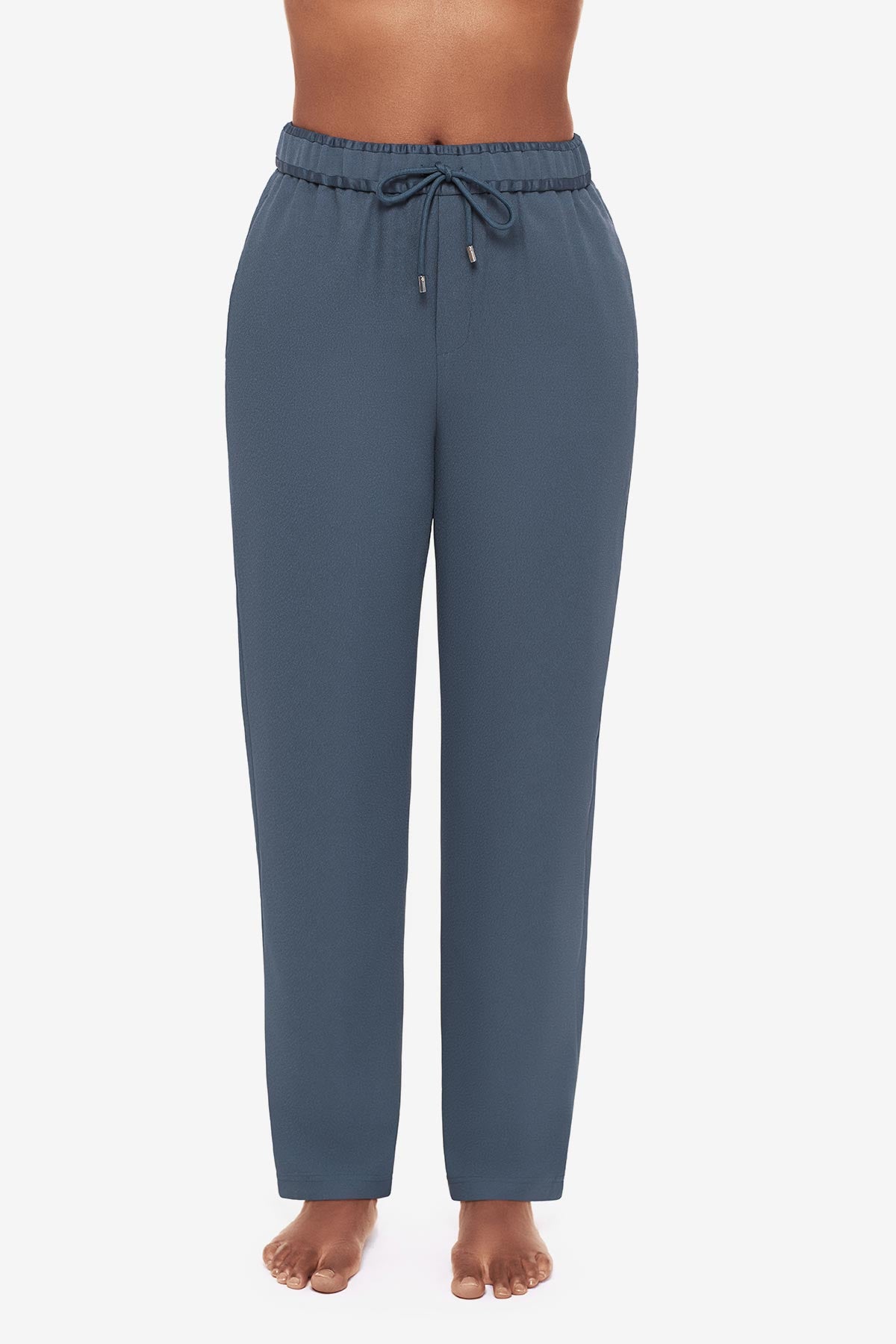 Close up of woman in blue jogger pants