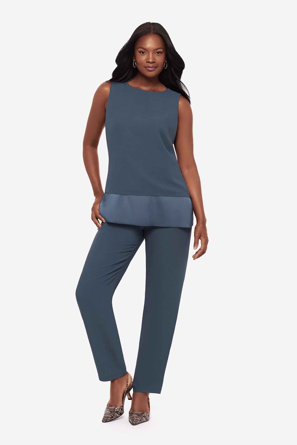 Woman wearing a blue layered tunic blouse with matching jogger pants