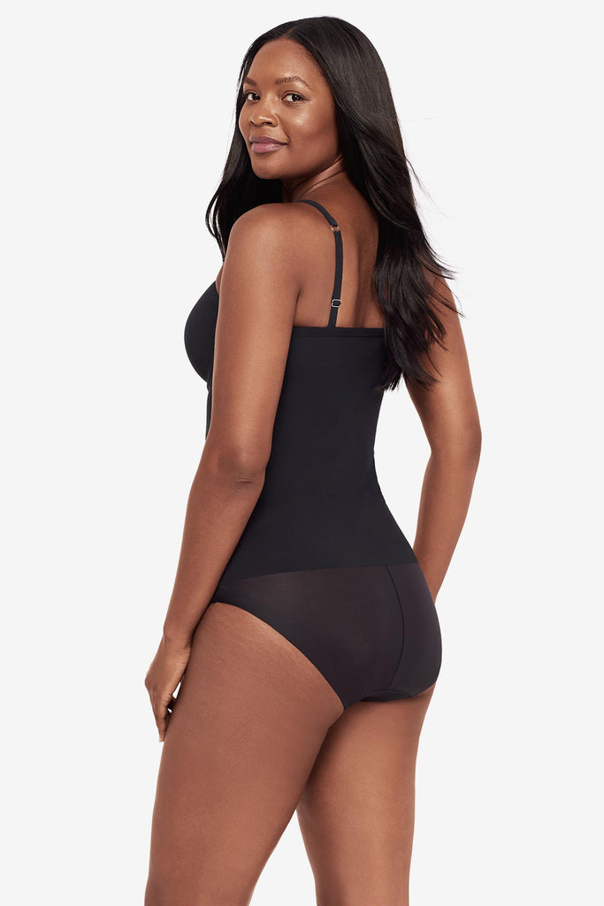 Woman turned left wearing a black cupped bra cami top