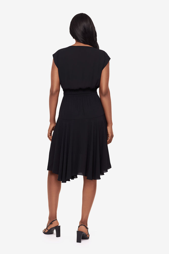 Woman faced away wearing a black short sleeve dress with a drawstring detail