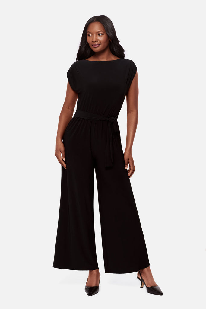 Woman wearing a black short sleeve romper