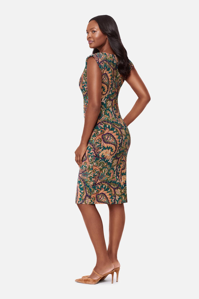 Woman turned left wearing a multicolor paisley printed short sleeve dress