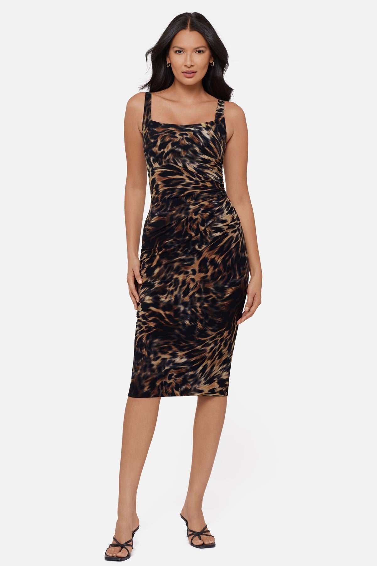 Woman wearing an animal printed sleeveless mid length dress