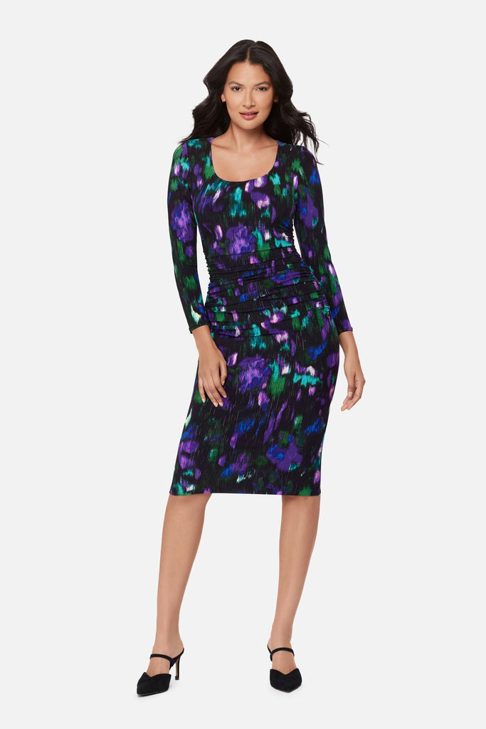 Woman wearing a multicolored print long sleeve dress