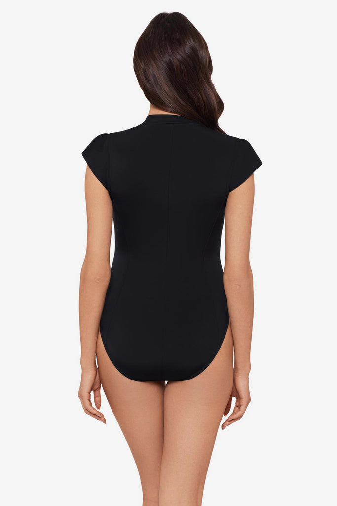 Woman turned away wearing a black one-piece swimsuit with extra wide cap sleeves