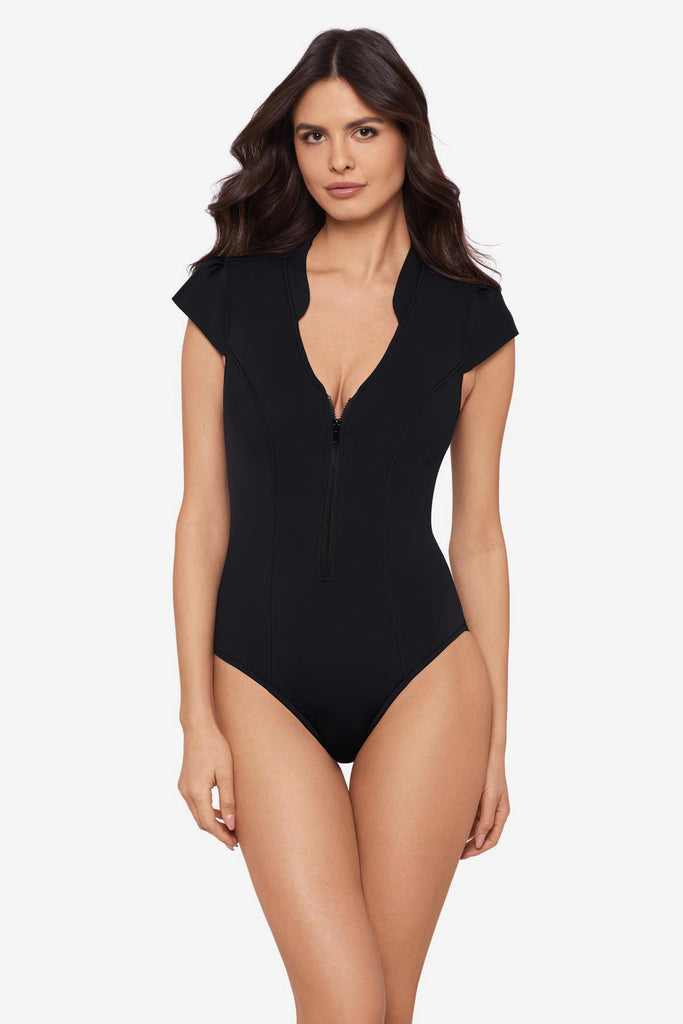 Woman wearing a black one-piece swimsuit with extra wide cap sleeves
