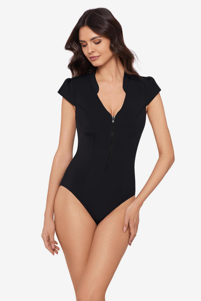 Woman wearing a black one-piece swimsuit with extra wide cap sleeves