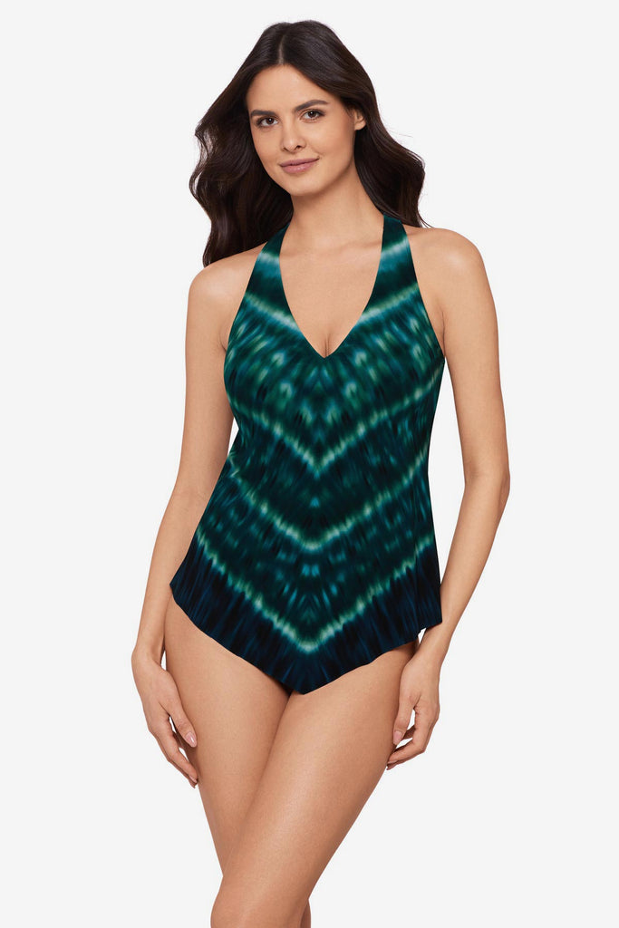 Woman wearing a green tie-dyed tankini top with a v-neck