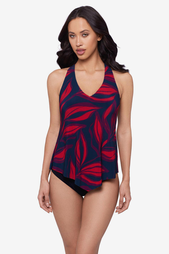 Woman wearing a red leaf print tankini top