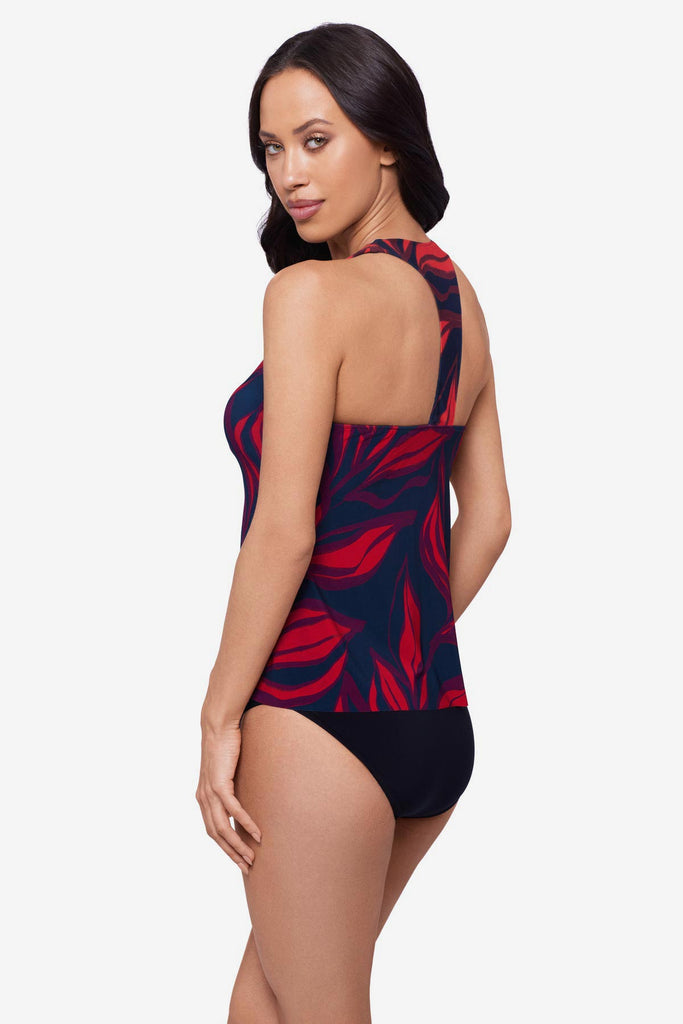 Woman turned right wearing a red leaf print tankini top