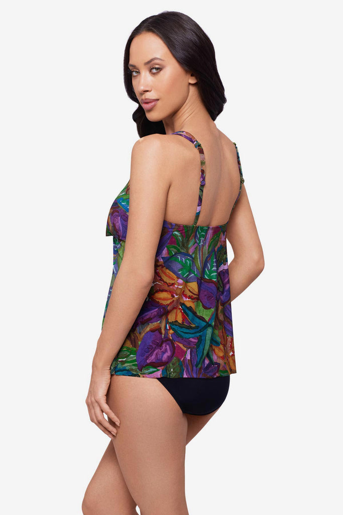 Woman turned left wearing a jungle print tankini top with O ring straps