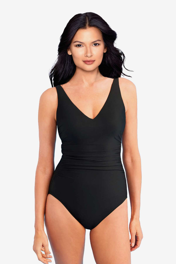 Girl wearing a one piece swim dress.