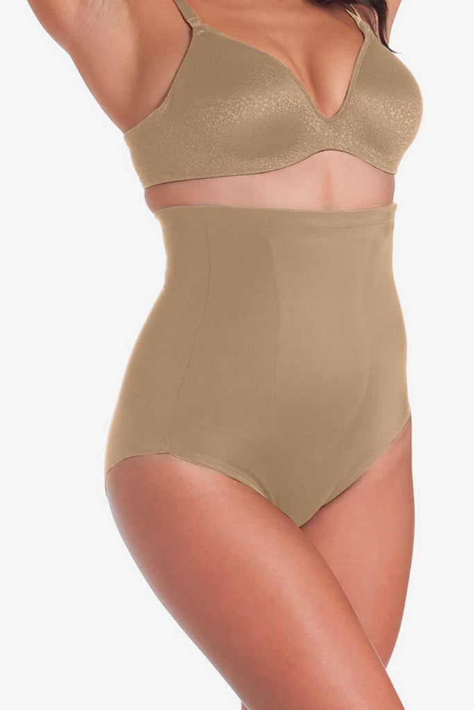 Woman in a  plus size swim suit that cinches waist.