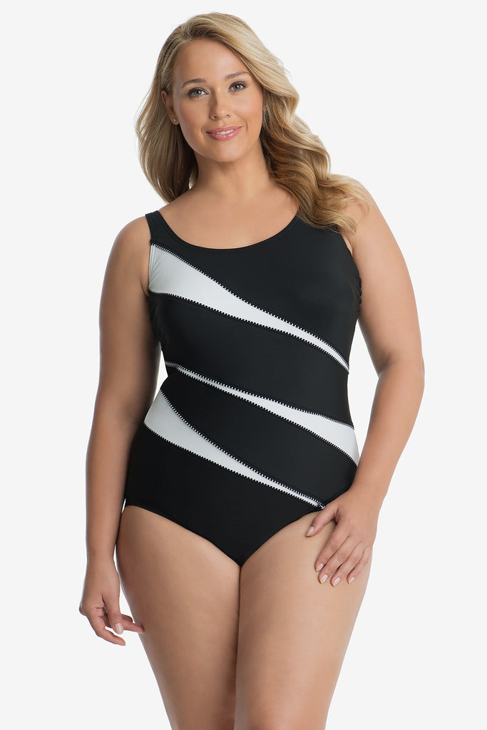 Woman in a black swim suit with white strips.