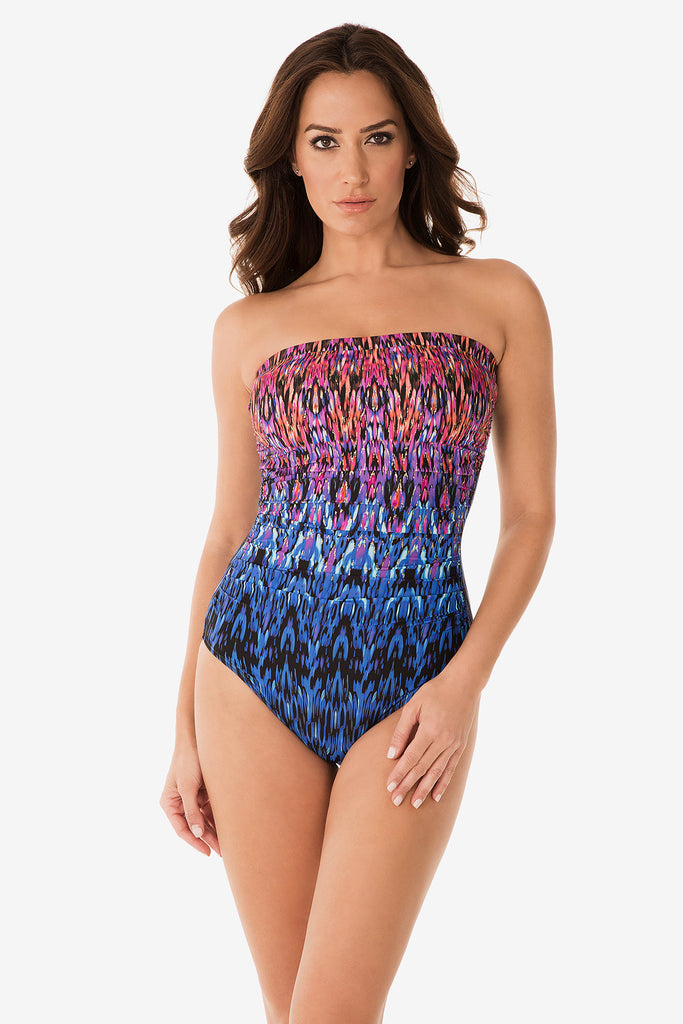 Woman in a printed one piece swim suit.