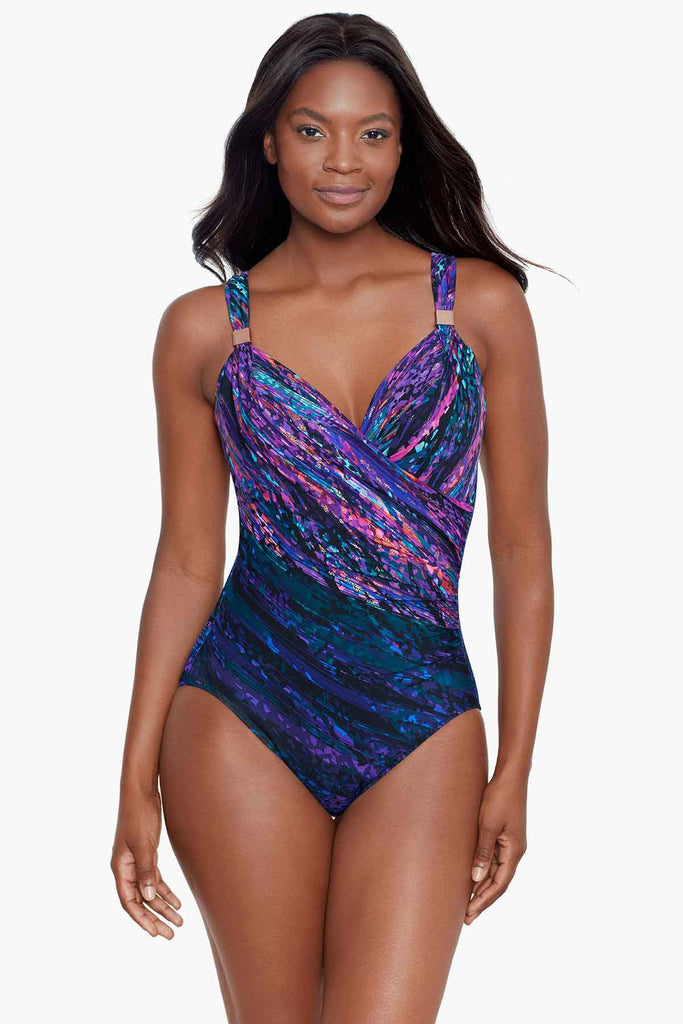 Woman wearing a printed miracle one piece swim suit.