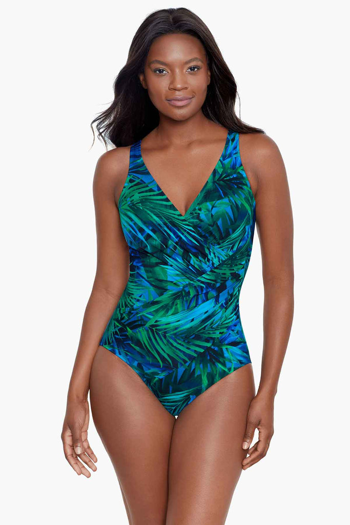 An african american woman wearing a one piece swim suit.