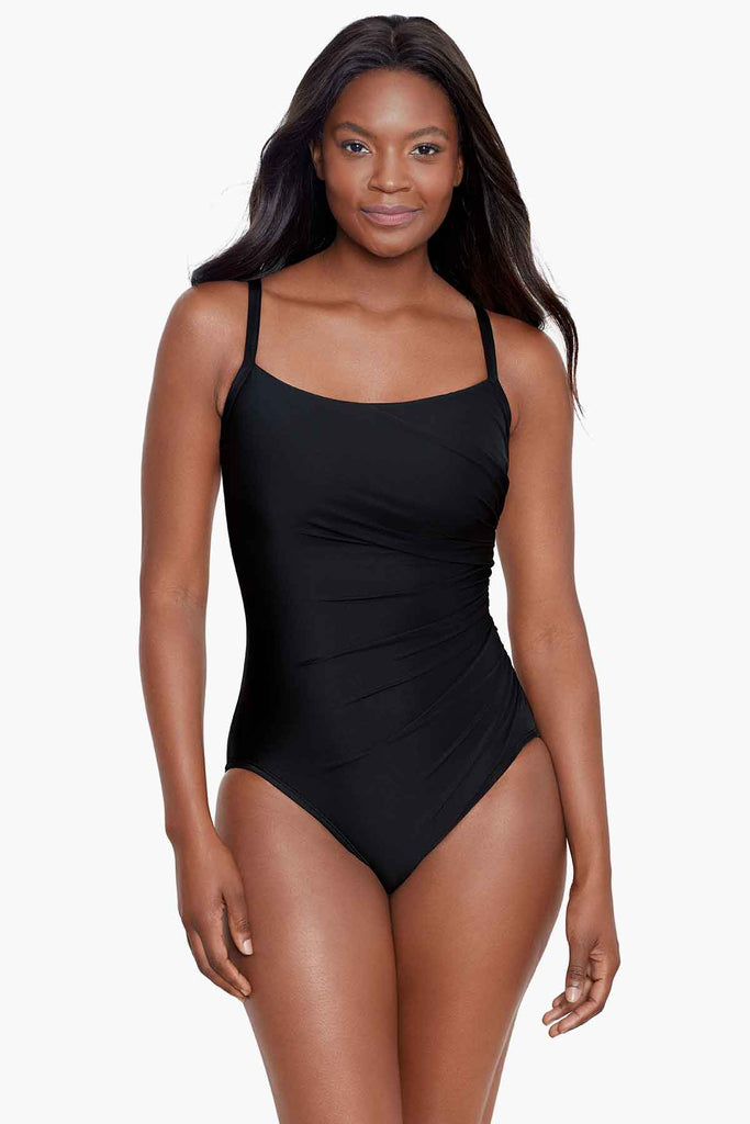 An african american woman wearing a miracle swim suit.