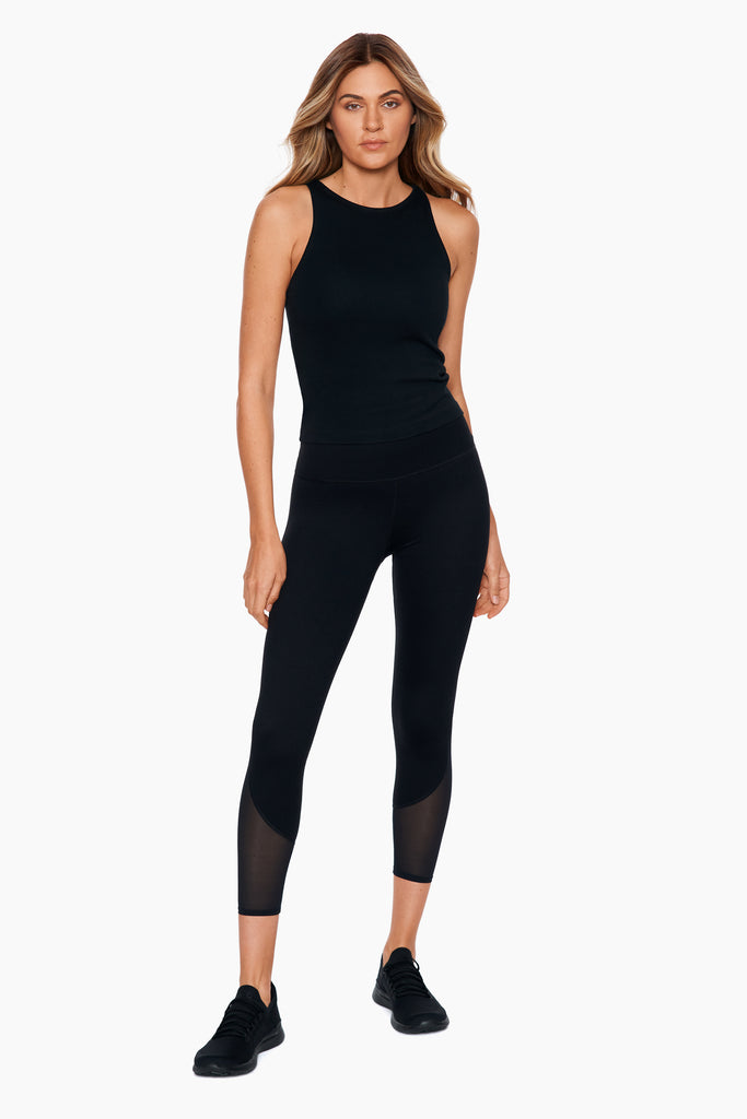 Woman in a cut out leggings.