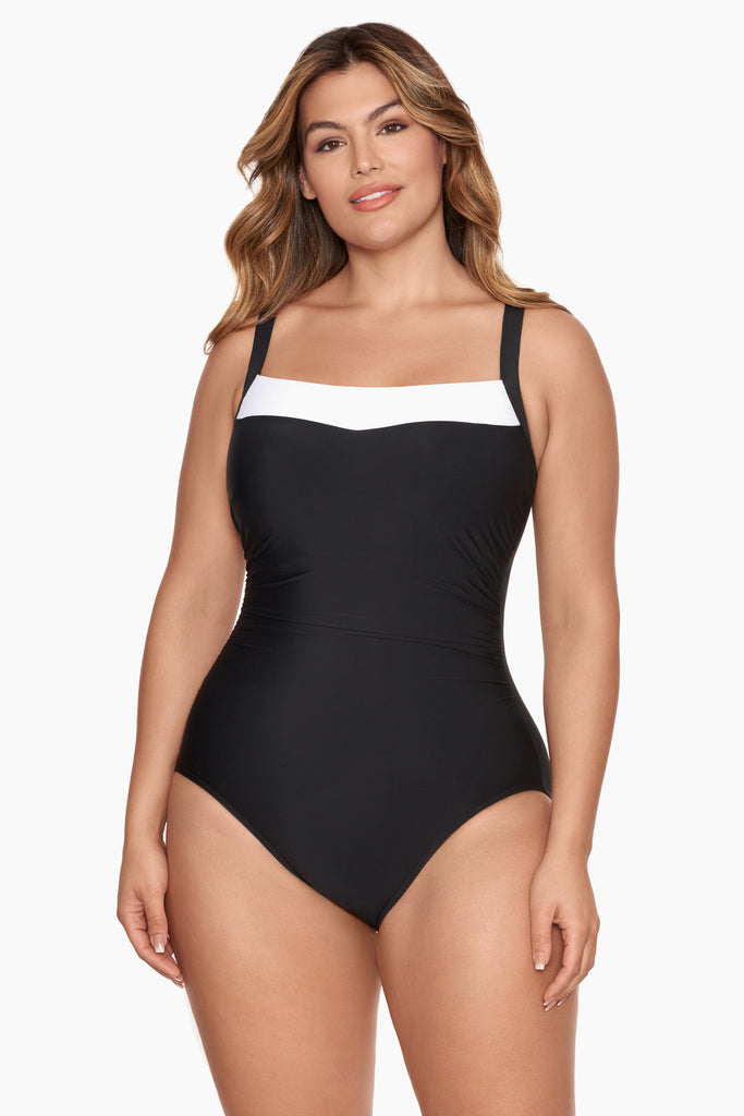 Girl in a one piece swim suit.