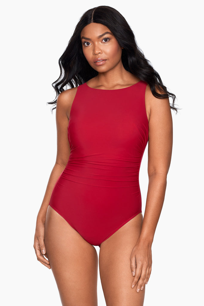 Woman in a tummy control one piece swim suit.