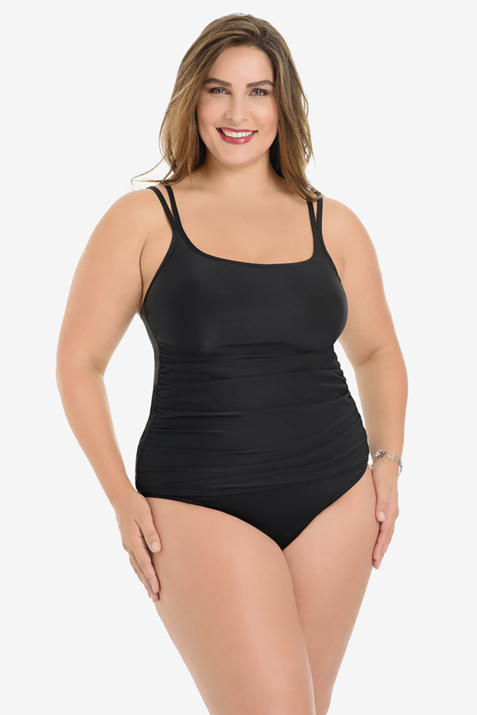Woman wearing a miracle suit tankini top.